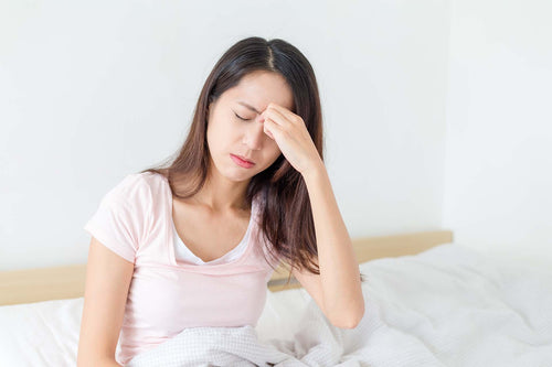 a woman suffering from allergy fatigue